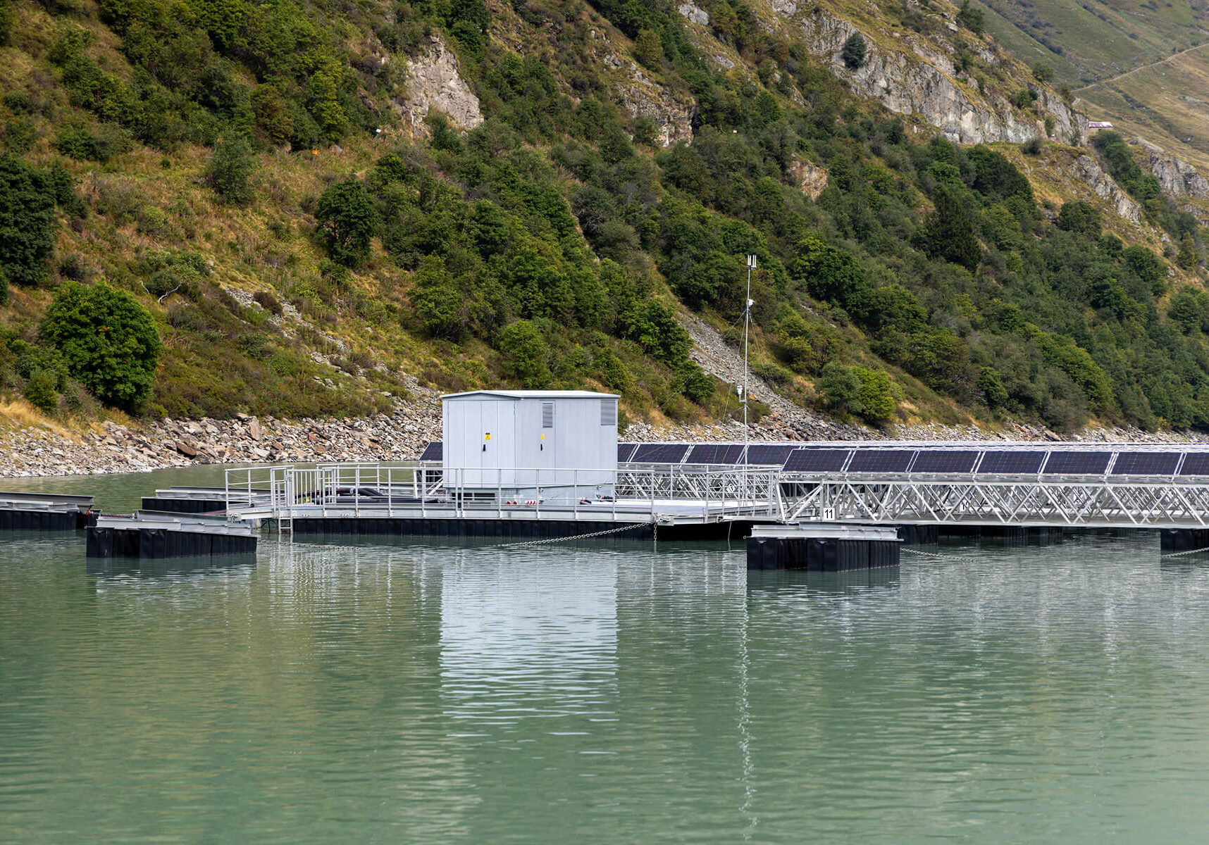 Floating solar panels on a calm lake.